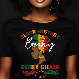 May include: Black t-shirt featuring a design celebrating Black History. The graphic includes the words "Black History Breaking Every Chain" and an illustration of a woman with a head wrap and gold hoop earrings.