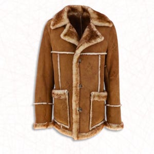 May include: A brown shearling coat with a notched collar, button closure, and two front pockets. The coat features a light brown shearling lining and trim. The coat has a classic design.