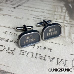 May include: A set of three ceramic vases in varying heights and shapes. The vases are glazed in a matte white finish, offering a minimalist aesthetic. The tallest vase is approximately 25 cm high.