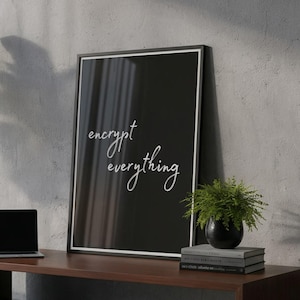 May include: A modern interior scene featuring a dark wood bench with a laptop, framed art, and a small potted plant. The black framed art has the words "encrypt everything" in white script. A large potted plant is on the left.