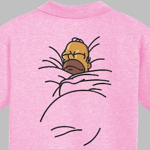 May include: Pink polo shirt with an embroidered design of Homer Simpson. The cartoon character is depicted in a humorous pose. The shirt has short sleeves and a classic polo collar. The shirt is made of a soft material.