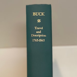 May include: A green hardcover book titled "BUCK Travel and Description 1765-1865" with a gold printing press logo and the text "BURT FRANKLIN NEW YORK" on the spine.