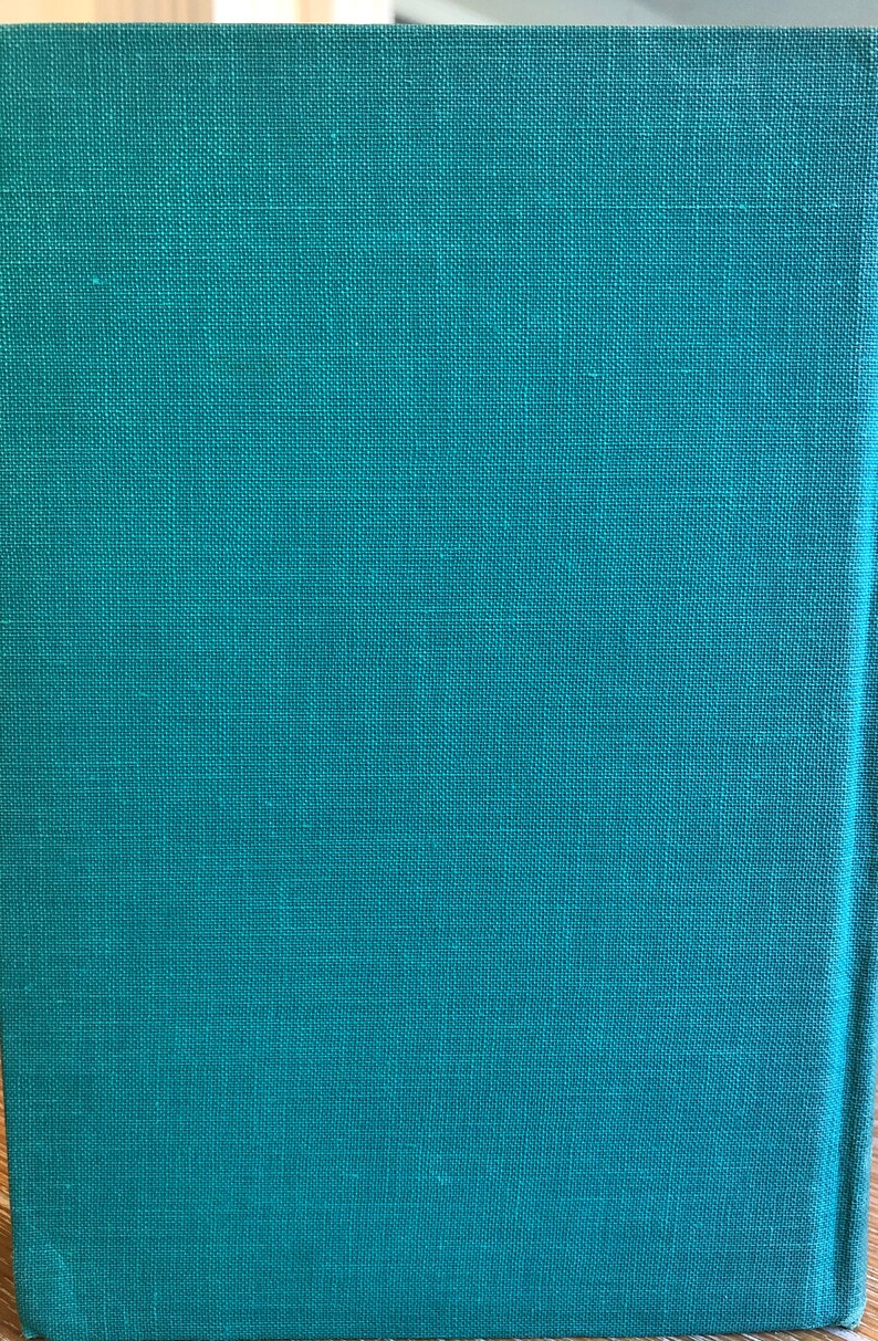 May include: A teal green book cover with a textured fabric finish.