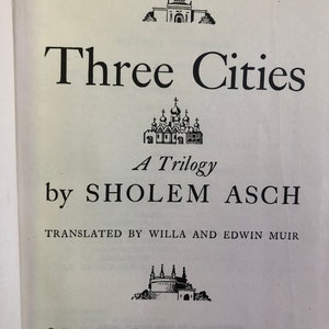 May include: Book cover for "Three Cities: A Trilogy" by Sholem Asch, translated by Willa and Edwin Muir. The cover features a black and white illustration of a city skyline with three churches.