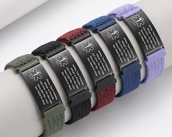May include: Five medical alert bracelets with braided elastic bands in olive, black, maroon, navy, and lavender. Each features a black metal plate engraved with the Star of Life symbol and text: Kelsey, Type 2 Diabetes, Allergic to Penicillin, ICE: Chris 123-456-7890, Stacy: 098-765-4321, See Wallet for Meds.