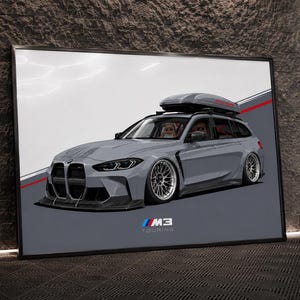 May include: A framed digital illustration of a grey BMW M3 Touring estate car featuring a roof cargo box, lowered suspension, and multi-spoke silver wheels. The artwork displays the M3 Touring logo in the bottom centre against a grey background.