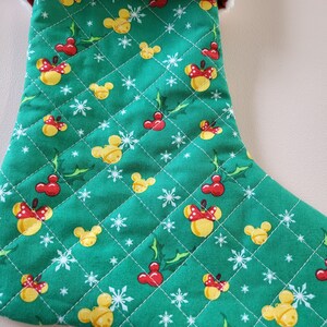 Quilted mickey and minnie holiday stockings.