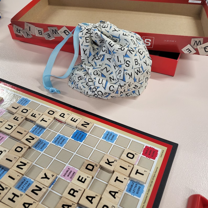 Scrabble word tile drawstring storage bag.