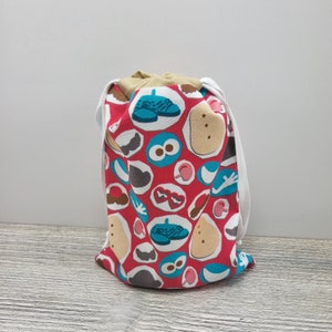 Small drawstring bag to hold Mr. Potato Head pieces and parts.