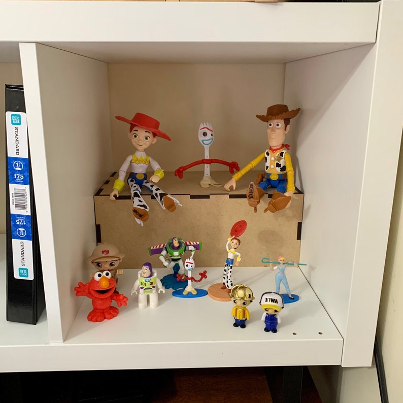 dvd display shelf displaying toy store toys