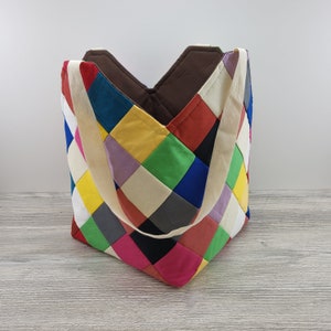 Rainbow patchwork square bottom machine washable shopping tote.