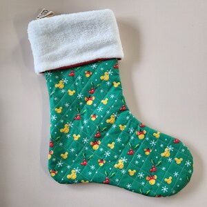 Quilted disney holiday stockings with fleece topper.