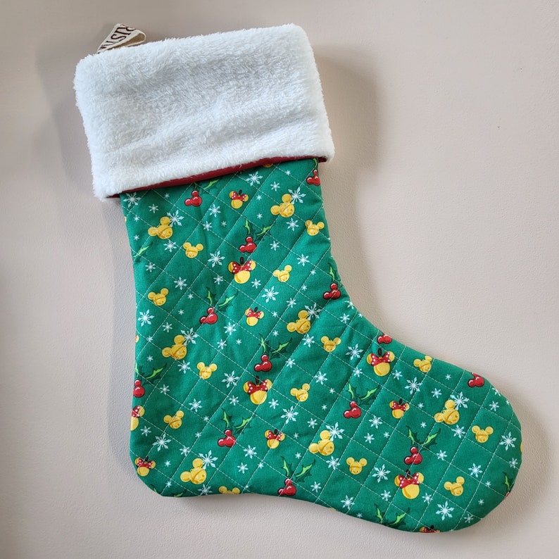 Quilted disney holiday stockings with fleece topper.