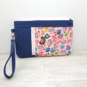 We Rise By Lifting Others Zippy Clutch with detachable Wristlet Strap