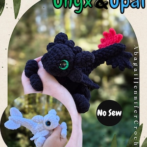 May include: Two crocheted dragon plushies labelled Tiny Tots Onyx & Opal. One is black with a red tail fin and green eyes, the other is white with blue eyes. Both feature a no-sew design, with the text No Sew visible on the image.