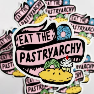 May include: A stack of pink and white stickers with the text "Eat the Pastryarchy" in black lettering. The stickers feature a pie, a donut, and a cupcake.