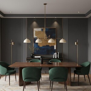 May include: A dining room set featuring a rectangular wooden table with a dark finish and six upholstered green chairs. Above the table hangs a linear chandelier with four off-white dome-shaped shades and a brass-toned metal frame.