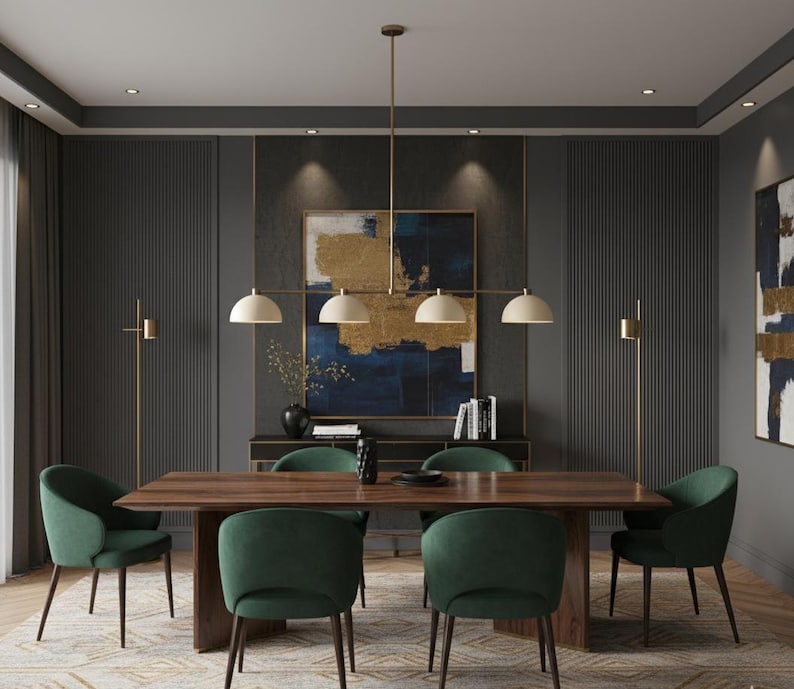May include: A dining room set featuring a rectangular wooden table with a dark finish and six upholstered green chairs. Above the table hangs a linear chandelier with four off-white dome-shaped shades and a brass-toned metal frame.