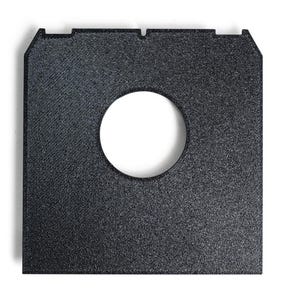 May include: A square, black object with a circular hole in the center. The object has a textured surface and a rectangular shape with two small notches at the top. The hole is white and the object is set against a white background.