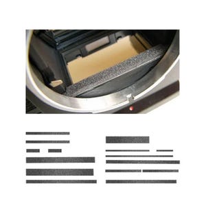 May include: Close-up of a camera body interior with a light-colored foam strip and a set of replacement light seals. The camera body is silver and black, with a red dot visible.