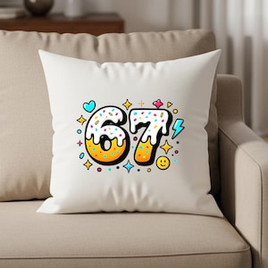 May include: White throw pillow with a colorful graphic of the number 67, designed to look like a donut with sprinkles. The design includes a blue heart, yellow stars, and a smiling face.