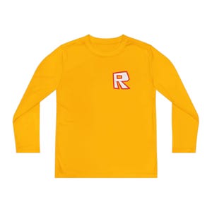 May include: Mustard yellow long-sleeve shirt with a small red and white letter "R" logo on the chest. The shirt has a crew neck and long sleeves, suitable for cooler weather. The fabric appears to be a lightweight, breathable material.