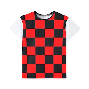 May include: A short-sleeved t-shirt featuring a bold checkerboard pattern in red and black across the chest and back. The sleeves and upper shoulders are white, creating a striking contrast. The shirt has a crew neck and a casual, everyday style.