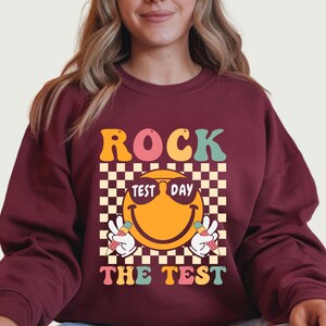 May include: A rustic wooden sign with the text "Welcome to our home" in white lettering. The sign features a distressed finish and a simple, inviting design, perfect for entryway decor.