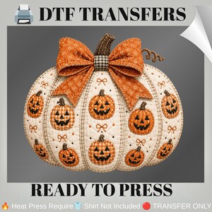 May include: A DTF transfer featuring a quilted-style pumpkin graphic with a large orange patterned bow on top. The pumpkin is cream-coloured with orange checkered jack-o'-lantern faces and small bow accents. Text reads DTF TRANSFERS READY TO PRESS.