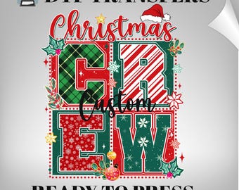 May include: A DTF transfer sheet featuring the text "Christmas CREW" with the word "Custom" in script. The letters are decorated with red and green plaid, candy cane stripes, and snowflake patterns, accented by holly, ornaments, and a Santa hat.