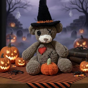 May include: A handmade Halloween-themed teddy bear wearing a black witch hat with orange trim. The bear has a red heart patch and is surrounded by carved pumpkins, spiders, and a small orange pumpkin. The background features a spooky graveyard scene.