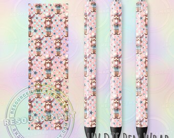 May include: Pink pen wraps featuring a repeating pattern of cowboy nutcrackers and blue stars. The design includes a sheet of the pattern and three assembled pens. The text "UV DTF PEN WRAP" is visible.