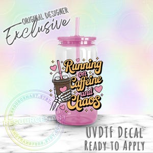 May include: A clear plastic tumbler with a pink lid and straw. The tumbler features the text "Running on Caffeine and Chaos" with a graphic of a coffee drink held by a skeleton hand. The words "Original Designer Exclusive" are also visible.