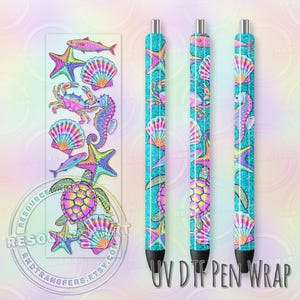 May include: Three pens with a turquoise glitter design featuring colorful sea creatures like starfish, seahorses, and turtles. A matching sticker sheet with the same marine life illustrations is also visible. The text "UV DTF PEN WRAP" is printed on the pens.