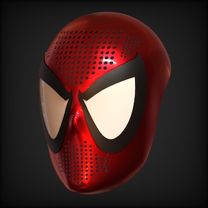 May include: A glossy red full-face mask featuring large, almond-shaped white eye lenses outlined in thick black borders. The forehead and chin areas are covered in a dense, uniform pattern of small, circular black ventilation holes.