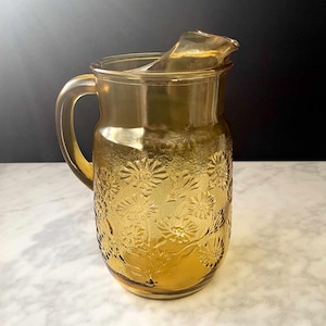 1970s Amber Glass Pitcher Embossed Daisies | Golden Honey Sunburst Pattern Ice Lip | Retro Barware