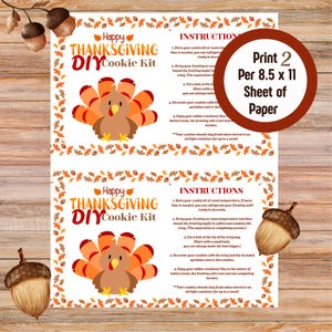 May include: Thanksgiving DIY cookie kit print featuring a cartoon turkey with orange and brown feathers. The text "Happy Thanksgiving DIY Cookie Kit" is displayed. Instructions are included on the print, which is designed to print two per 8.5 x 11 inch sheet.