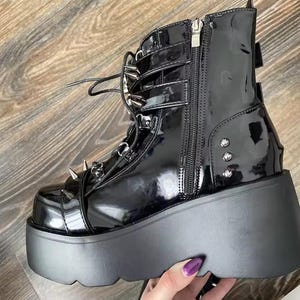Elevate your dark aesthetic to legendary heights. Our Gothic Vampire Mid-Calf Boots are the ultimate fusion of Victorian elegance and modern punk edge. Featuring a towering 8cm+ super high wedge, these boots are engineered for those who want to dominate the room without sacrificing the comfort needed for a long night at a convention, a club, or a moonlit stroll.