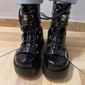 Elevate your dark aesthetic to legendary heights. Our Gothic Vampire Mid-Calf Boots are the ultimate fusion of Victorian elegance and modern punk edge. Featuring a towering 8cm+ super high wedge, these boots are engineered for those who want to dominate the room without sacrificing the comfort needed for a long night at a convention, a club, or a moonlit stroll.