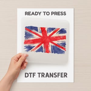 May include: A DTF transfer sheet with a distressed Union Jack design in red, white, and blue. The words "READY TO PRESS" and "DTF TRANSFER" are printed on the white background.