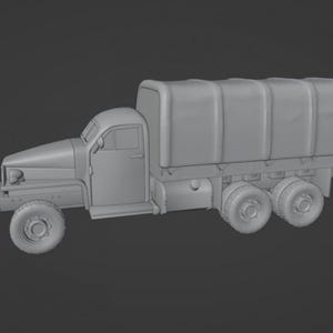 May include: A gray model of a vintage military truck with a covered cargo bed. The truck has a detailed cab with doors, windows, and a hood. The tires are visible, and the truck appears to be a scale model.