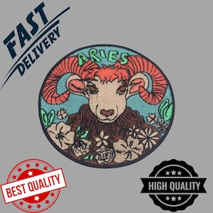 May include: Embroidered Aries zodiac sign patch. The circular patch features a ram with orange horns and the word "ARIES" in green. The ram is surrounded by flowers in a blue and brown colour scheme. The patch has a black border.