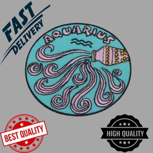 May include: A round, embroidered patch featuring the Aquarius zodiac symbol. The design includes a pink pitcher pouring pink wavy lines onto a light blue background, with the word "Aquarius" arched above. Black border.