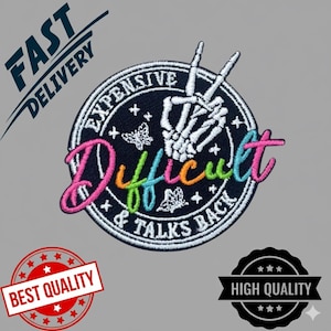 May include: Embroidered patch with the words "Expensive, Difficult & Talks Back" in colourful script. The patch features a skeleton hand making a peace sign, butterflies, and stars on a black background.