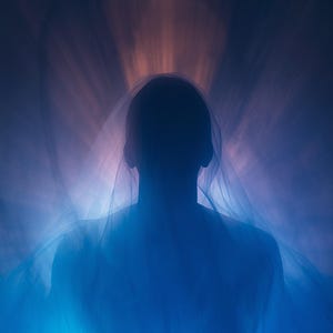 May include: A dark silhouette of a head and shoulders draped in a sheer, translucent fabric. The figure is illuminated from behind by a soft, glowing light that creates a blue and purple gradient effect, radiating outward from the center.