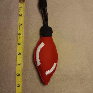 Soft red light bulb ornament