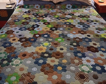 hand sewn hexi quilt in green, blue and brown