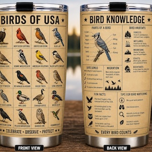 May include: A stainless steel tumbler featuring illustrations of various birds of the USA, with the text "Birds of USA" and "Bird Knowledge." The design includes bird facts and tips for bird watching.