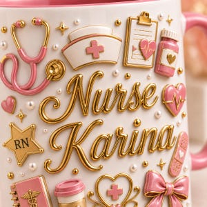 May include: White ceramic mug with a pink interior, featuring gold and pink 3D embellishments. The design includes a stethoscope, nurse's cap, hearts, and the name "Nurse Karina" in gold script. Accents include pearls and stars.