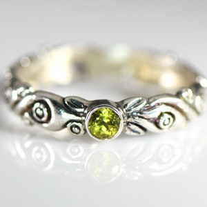 Choice of Peridot or Anthill Garnet in a Sterling Silver Band